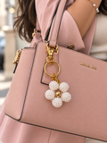 Porte clés fleur blanche et doré✨